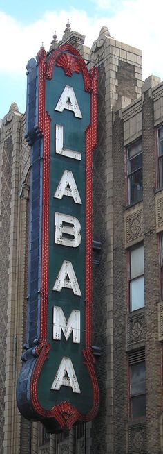 a large sign on the side of a building that says alambaa in white letters