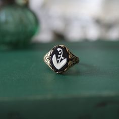 14x10mm lily of the valley cameo on your choice of an antiqued brass or antiqued silver Victorian ring base.I also have a lily necklace in my shop. Vintage Adjustable Signet Ring For Wedding, Adjustable Vintage Wedding Signet Ring, Vintage Hand Cast Jewelry For Weddings, Handmade Vintage Signet Ring For Gift, Vintage Brass Signet Ring As Gift, Vintage Hand Cast Signet Ring As Gift, Vintage Hand Cast Jewelry For Wedding, Antique Hand Cast Jewelry For Wedding, Lily Of The Valley Engagement Ring