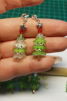 the tiny christmas tree earrings are green and red