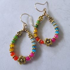 Multi Colored Jade Flower Dangle Hoop Earrings on Brass Wires 2.25" Long. These are super colorful and pretty. Bohemian Dangle Hoop Earrings For Spring, Multicolor Bohemian Hoop Earrings For Spring, Nickel Free Multicolor Dangle Flower Earrings, Multicolor Nickel-free Dangle Flower Earrings, Nickel-free Multicolor Dangle Flower Earrings, Multicolor Teardrop Hoop Earrings Bohemian Style, Multicolor Handmade Teardrop Flower Earrings, Handmade Multicolor Teardrop Flower Earrings, Multicolor Small Hoop Jewelry For Spring