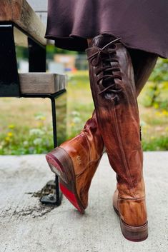 The modern classic MANCHESTER boot with clean lines and flat heel, has been a fan favorite for years. This combo of Black Rustic and Teak Rustic make the color block subtle but gives it a neutral palette. An inside zipper insures a great fit, MANCHESTER is every woman's essential tall boot. Handmade, handfinished leather Round toe with ankle zipper and laces on upper back Goodyear welted, manhole inspired rubber outsole for traction 17.5 inch shaft height, 1.25 inch heel, 14 inch circumference Made in Leon, Mexico Item# CDBWTD Bed Stu, Tall Boot, Shoe Boutique, Store Hours, Women Essentials, Neutral Palette, Goodyear Welt, Cold Brew, Tall Boots