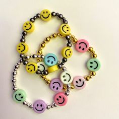 "Choose from small yellow smileys or 5 rainbow smileys (colors will be random). Your choice of gold, silver, rose gold, or gunmetal spacers.  Bracelet will be 7\" unless requested in order comments. All packages will be shipped untracked USPS first class. Option to upgrade shipping at checkout." Smiley Face Round Jewelry For Friendship, Round Smiley Face Jewelry For Friendship, Customizable Fun Jewelry For Everyday, Smiley Face Round Beads Friendship Jewelry, Playful Customized Everyday Jewelry, Customizable Playful Everyday Jewelry, Playful Smiley Face Jewelry For Friendship, Playful Smiley Face Jewelry For Everyday, Cheerful Smiley Face Jewelry For Everyday