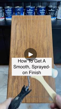 a person is using a toothbrush to clean a wooden plaque with the words how to get a smooth, sprayed - on finish