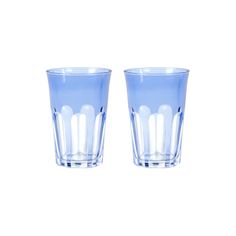 two blue glasses sitting next to each other