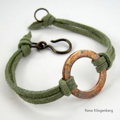 a bracelet with an old metal ring on it