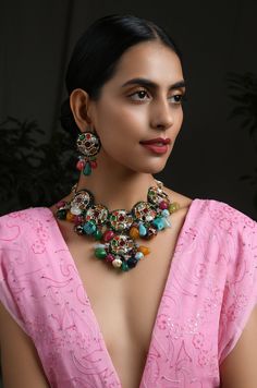 Multicoloured Navrattan Kundan Inspired Necklace with Earrings. This beautifully handcrafted necklace is set in silver and copper alloy and plated with 22k gold. This necklace with a twist of Pearl stones by Paisley Pop is a perfect accessory for an Indian Bride. LENGTH Necklace Size - Length 16 inches Closure - Adjustable Thread Dori DETAILS -100% top Quality Faux Glass Polki -22K gold and silver Plated silver copper alloy. -Handcrafted in our all girls workshop in Paisley Pop Studio, Jammu and Multicolor Temple Jewelry Pendant Set, Multicolor Multi-stone Kundan Necklace For Gift, Bohemian Meenakari Pendant Jewelry, Multicolor Tilla Earrings For Rituals, Multicolor Round Temple Jewelry Necklaces, Elegant Multicolor Jewelry For Rituals, Traditional Multicolor Jewelry Sets With Oxidized Finish, Traditional Multicolor Oxidized Jewelry Sets, Multicolor Round Temple Jewelry