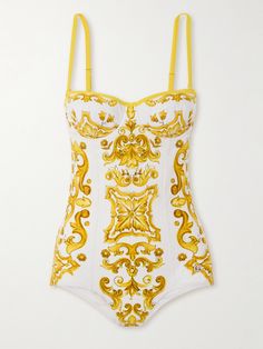 Dolce&Gabbana's swimsuit is perfect for plunging into the sea or the hotel's infinity pool. Covered with a ceramics-inspired print paying homage to the art of Majolica, it has wired balconette cups and adjustable, removable straps. Luxury One-piece Swimwear For The Beach, Luxury Fitted Swimwear For Summer, Luxury One-piece Swimwear For Summer, Luxury One-piece Swimwear, Luxury Swimwear For Pool, Luxury Fitted Beach Swimwear, Luxury Fitted Swimwear For Swimming, Elegant White Swimwear For Sunbathing, Luxury Summer Swimwear For Vacation