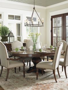 a dining room table with chairs around it