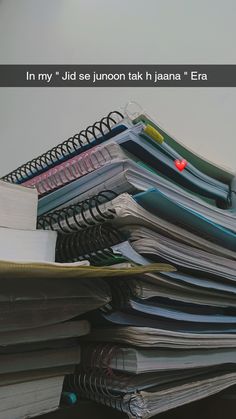 a pile of papers sitting on top of a desk