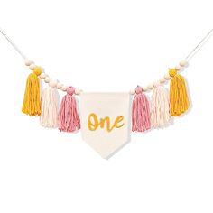 a one banner with tassels hanging from it