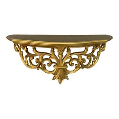 a gold shelf with an ornate design on it