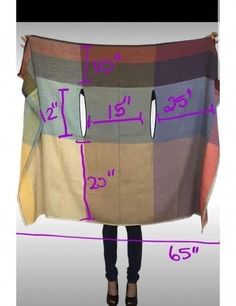 a woman is holding up a blanket with the measurements for her pants and shoes on it