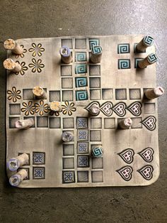 a close up of a board game with dices and flowers on the table top