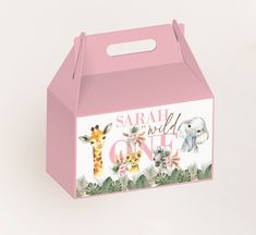 a pink box with an image of giraffes and elephants on it