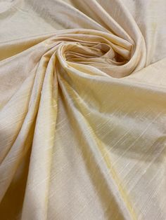 a close up view of a plain yellow fabric