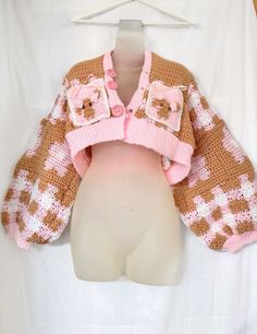 a teddy bear sweater on top of a mannequin