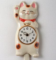 a clock with a cat design on it