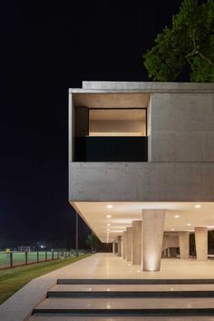 the concrete building has stairs leading up to it