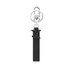 LOUIS VUITTON® - Lv Aerogram Key Holder And Bag Charm - Black Modern Black Bag With Metal Logo, Modern Black Bags With Metal Logo, Elegant Black Bag With Logo Charm, Luxury Black Bag With Logo Charm, Lv Key Holder, Louis Vuitton Official, New Classic, Key Holder, Card Wallet