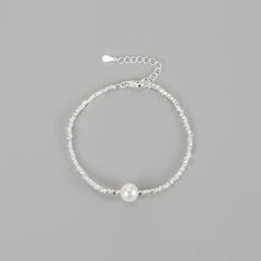 Elevate your wrist with our stunning Natural Pearl Sterling Silver Bracelet. Crafted with genuine pearls and high-quality sterling silver, this bracelet exudes elegance and sophistication. The natural pearls add a touch of luxury, making it a perfect accessory for special occasions or everyday wear. Embrace timeless beauty with this exquisite bracelet that will effortlessly enhance your style. Material: 925 Sterling Silver Stone: 8mm Natural Freshwater Pearl Length: 16+3cm Pearl Charm Beaded Bangle Bracelet, Pearl Bangle With Pearl Charm, Elegant Silver Crystal Bracelet With Pearl Charm, Adjustable Sterling Silver Bracelet With Pearls For Gift, Pearl Bracelets With Silver Beads As A Gift, Silver Beaded Bracelets With Pearl Charm As Gift, Pearl Bracelets With Silver Beads For Gifts, Gift Pearl Bracelets With Silver Beads, Adjustable Sterling Silver Pearl Bracelet For Gift