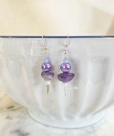 This pair of silver plated earrings feature nickel free ear wires, hoops, along with amethyst chunk beads, light purple faux pearls and lavender and white faceted glass rondelle beads and a silver spacer on spear posts. Each pair of earrings comes with silicone stoppers to hold the earring in place securely. This pair measures 2 inches in length.  o ~ TURNAROUND TIME ~ Ready to ship items, such as earrings, will ship in 1-2 business days.  o ~ CUSTOMER CARE ~ Please contact us if you have any qu