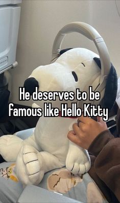 someone is holding a stuffed dog that says he deserves to be famous like hello kitty