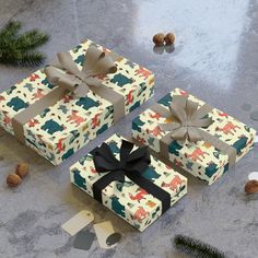 three wrapped presents sitting on top of a table