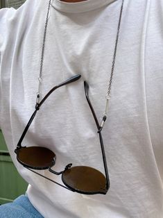 A handmade sunglasses chain for men that is made in silver color from metal. I also use two metal parts at the front side of the chain, that makes this chain extra stylish. In Christina Christi Jewels store you can see a lot of fashion accessories for men and women. You can have them in 2-4 Days with DHL EXPRESS SHIPPING MATERIALS - Metal Chain in Silver Color. DIMENSIONS - You can choose in three different dimensions for your glasses. (70 - 80 - 90 cm) # FIND ALL MY DESIGNS IN GLASSES CHAINS HE Modern Silver Glasses Chains As Gift, Modern Silver Glasses Chains For Gift, Modern Adjustable Silver Glasses Chains, Adjustable Silver Metal Glasses Chains, Adjustable Silver Glasses Chain With Chain Strap, Handmade Silver Metal Glasses Chains, Silver Metal Adjustable Glasses Chain, Silver Glasses, Eyeglasses Chain