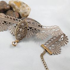 Product Info Product Care Shipping With a delicate scalloped edge, this Victorian scalloped choker is so elegant! As the focal, I've centred a pretty, oxidized brass connector with Swarovski crystal elements on the lace. Details at a glance: handmade Victorian Scalloped Lace Brass Pendant Choker 38 x 22mm oxidized brass setting with Swarovski crystal elements 10mm crystal rivoli style charm measures 11.75" in length with a 6" extension chain complete with crystal rivoli style charm lobster closu Lace Trim Choker Jewelry For Party, Lace Trim Choker For Party, Elegant Lace Choker Jewelry, Vintage Metal Choker For Wedding, Lace Trim Choker Jewelry Gift, Vintage Lace Choker Jewelry, Vintage Lace Choker As A Gift, Vintage Lace Choker For Gifts, Vintage Lace Necklace For Gift