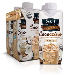 three bottles of coconut milk and one bottle of cocoa latte on a black background