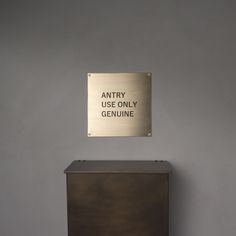 a metal sign that reads,'sorry use only genuine'on the side of a cabinet