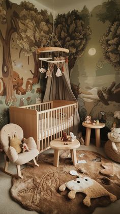 a baby's room with a teddy bear theme on the wall and rugs