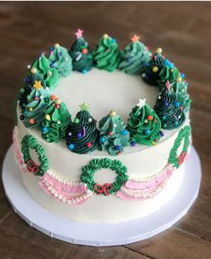 a decorated christmas cake sitting on top of a white plate