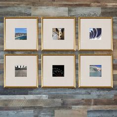 six framed photographs hang on the wall in front of a wooden paneled wall with wood slats