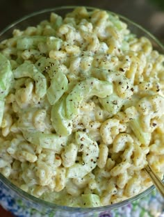 a bowl filled with macaroni salad on top of a table