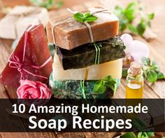 soap bars stacked on top of each other next to flowers and a bottle of oil