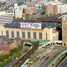 an aerial view of a train station in the city