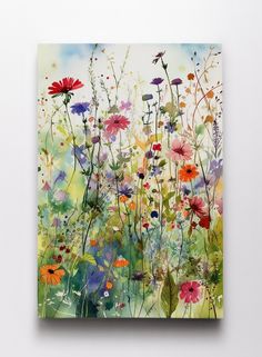 a painting of colorful flowers on a white wall