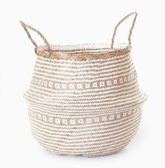 a white and tan basket with handles on it's sides, sitting against a white background