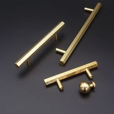 three different types of handles and knobs on a black surface