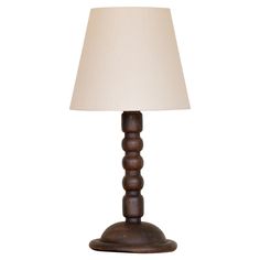 a wooden lamp with a white shade on it