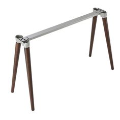 a metal and wood table with two legs on it, one leg is bent to the side