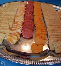 a metal tray topped with waffles and cheese