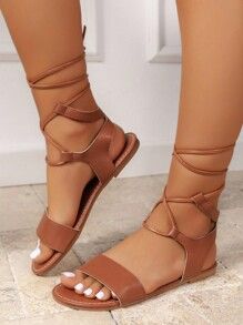 Casual Lace-up Sandals For Beach Season, Casual Open Toe Lace-up Sandals For Beach, Trendy Brown Lace-up Sandals For Summer, Casual Lace-up Sandals, Casual Brown Lace-up Sandals For Summer, Summer Cross-tied Strappy Sandals, Cross-tied Strappy Sandals For Summer, Casual Flat Lace-up Sandals For Beach Season, Summer Cross-tied Open Toe Sandals