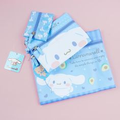 Use this set of kawaii zippered flat pouches to organize your things! The set features cute illustrations of a chubby Cinnamoroll with prints of hearts and avocados. Each pouch comes in a different size so you can use them for different purposes. Set includes 3 pouches Cute Rectangular Pencil Case With Removable Pouch, Cute White Stationery With Zipper Pouch, Cute Blue Bags With Pen Holders, Cute Blue Bag With Pen Holders, Kawaii White Stationery For Everyday Use, Cute White Zipper Pouch Stationery, Cinnamoroll Shopping, Kawaii Blue Pencil Case For Everyday Use, Blue Kawaii Pencil Case For Daily Use