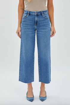 It's all about the wide leg in denim these days! Fit the trend in confidence with our Nori high rise crop denim from Hidden Jeans. Comfortable stretch, wide leg fit and a tried and true medium wash will have you feeling comfy and stylish. FINAL SALE, NO RETURNS Hidden 93% Cotton, 5% Poly, 2% Span Wide leg denim Raw hem 10.5" Rise, 27" inseam Wash cold, lay flat to dry Cropped Wide Leg Jeans, Cute Jeans, Jumpsuit Shorts Rompers, Wide Leg Denim, Short Sleeved Sweaters, Cropped Denim, Vest Top, Contemporary Fashion, Long Coat