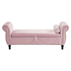 a pink velvet bench with buttons and nail polishing on the legs, sitting against a white background