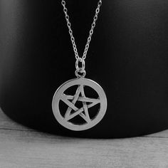 "This Pentacle necklace comes on a sterling silver chain that is available in different lengths. Please choose your desired length from the drop-down menu when placing the item in your shopping cart. { CHARM DETAILS } ★ Material: .925 Sterling Silver ★ Finish Color: Silver ★ Measurements: 7/8\" x 7/8\" ★ Dimensions: One-sided ★ Made in the USA { SIMILAR ITEMS } More pagan themed items available from my shop: https://www.etsy.com/shop/treasuredcharms/search?search_query=pagan { GIFT OPTIONS} Gift Sterling Silver Star Charm Necklace, Gothic Silver Jewelry With Star Charm, Goth Pendant, Pentacle Necklace, Pagan Symbols, Pandora Beads, Ribbon Necklace, Star Chain, Charm Necklace Silver