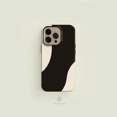 an iphone case with black and white shapes