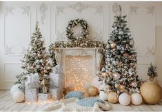 christmas decorations and presents in front of a fireplace